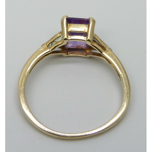 7045 - A 9ct gold, amethyst and diamond ring, 2.1g, O