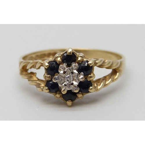 7049 - A 9ct gold, diamond and sapphire ring, 1.6g, K