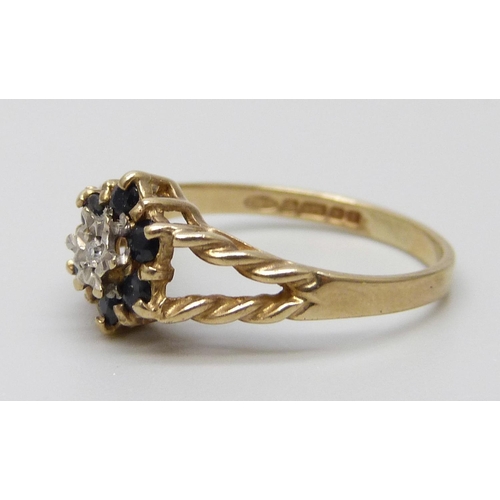 7049 - A 9ct gold, diamond and sapphire ring, 1.6g, K