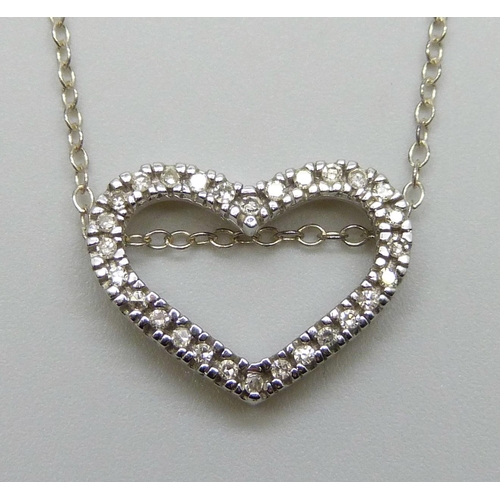 7051 - A 9ct white gold and diamond heart shaped pendant, 1.6g, (the fine silver chain requires a fastener)