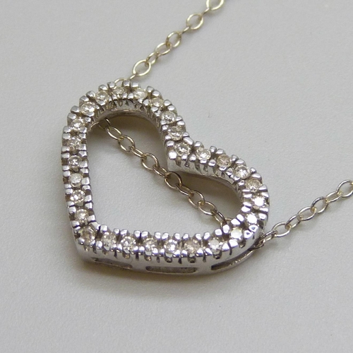 7051 - A 9ct white gold and diamond heart shaped pendant, 1.6g, (the fine silver chain requires a fastener)