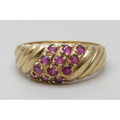 7053 - A 9ct gold and ruby ring, 2.8g, O