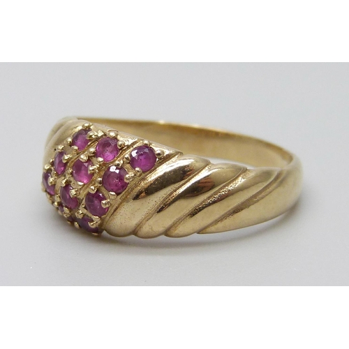 7053 - A 9ct gold and ruby ring, 2.8g, O