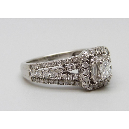 7054 - An 18ct white gold vari-cut diamond cluster ring, total diamond weight 1.00 carat stamped to band, 4... 