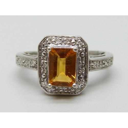 7055 - A 9ct white gold, citrine and diamond ring, 2.8g, K