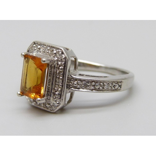 7055 - A 9ct white gold, citrine and diamond ring, 2.8g, K