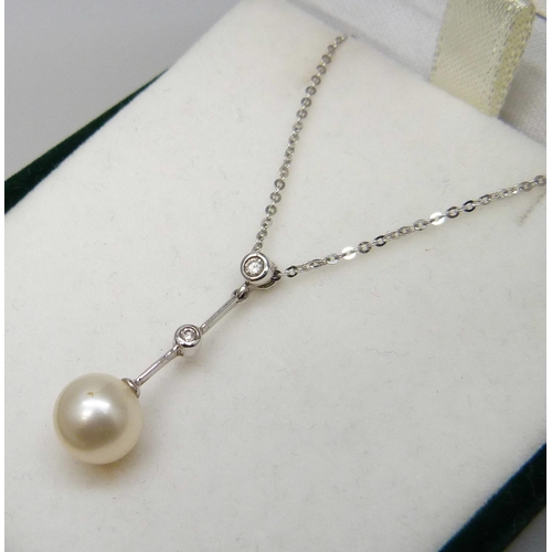 7060 - A 9ct white gold, diamond and pearl pendant on a fine 9ct white gold chain, 2.1g, chain 42cm