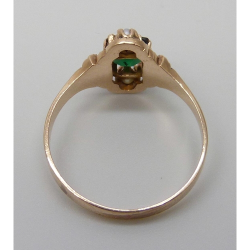 7062 - An Edwardian yellow metal ring set with a green stone and two seed pearls, 2.1g, N, tests as 14ct go... 