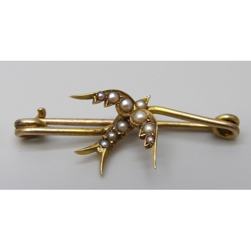 7065 - A Victorian yellow metal swallow brooch set with seed pearls, 1.9g, and a Victorian 9ct gold insect ... 