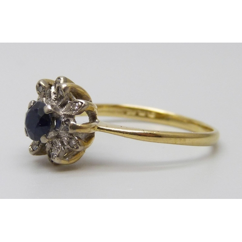 7070 - An 18ct gold, sapphire and diamond cluster ring, 3.2g, Q