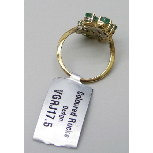 7071 - A silver gilt double cluster emerald ring, J