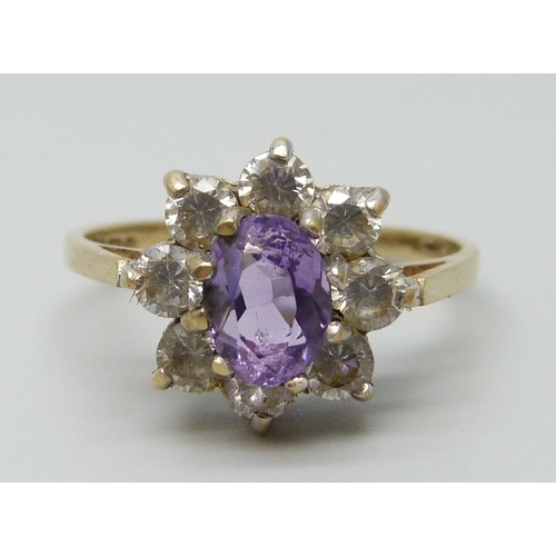 7080 - A 9ct gold, amethyst and white stone ring, 2.4g, M/N