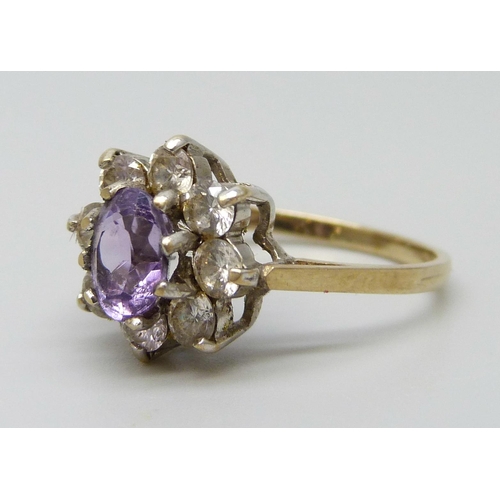 7080 - A 9ct gold, amethyst and white stone ring, 2.4g, M/N