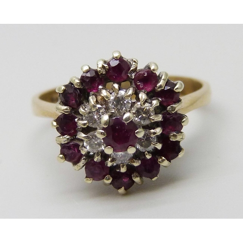 7082 - A 9ct gold, ruby and diamond cluster ring, 2.8g, M