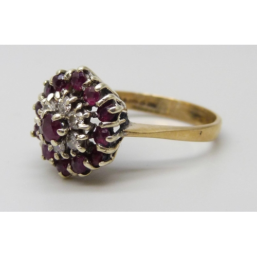 7082 - A 9ct gold, ruby and diamond cluster ring, 2.8g, M