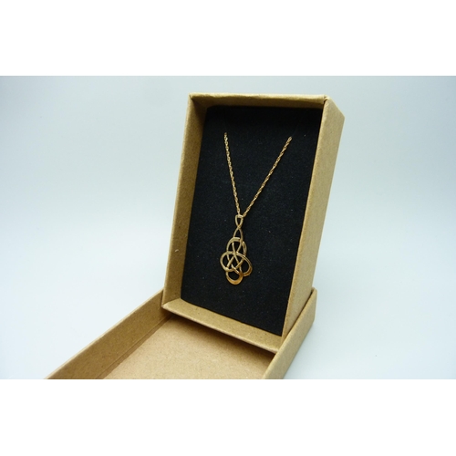 7084 - A 9ct gold Celtic style pendant and chain, 1.4g