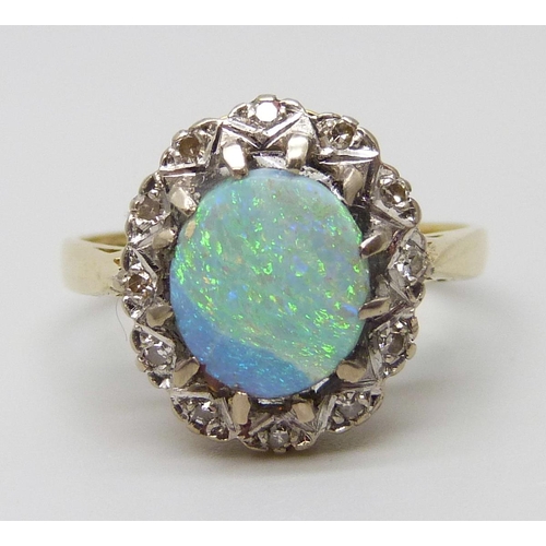 7089 - An 18ct gold, opal and diamond ring, 5.1g, N