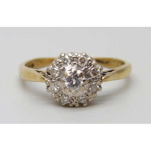 7097 - An 18ct gold diamond cluster ring, 3g, O