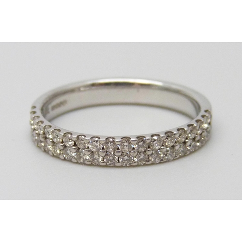 7104 - A 9ct white gold ring set with 0.5 carats of diamonds, 2.3g, L