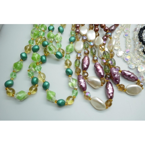 7119 - A collection of vintage glass necklaces