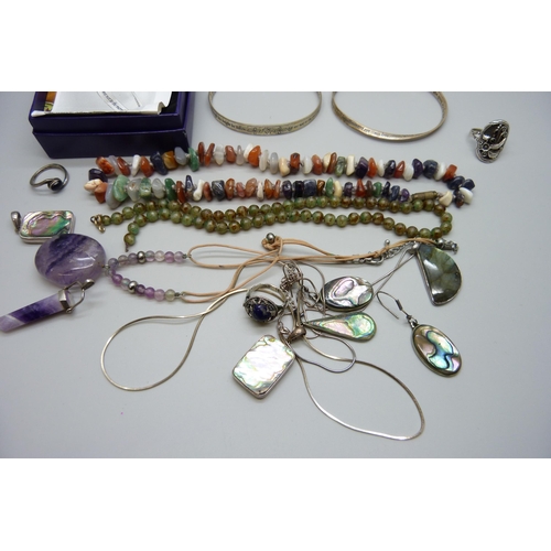 7144 - Two silver bangles, 28g, a silver ring, silver and abalone pendants, gemstone jewellery and other wh... 