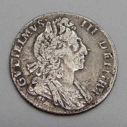 7240 - Coins; a William III 1699 silver sixpence plumes, very rare, high grade