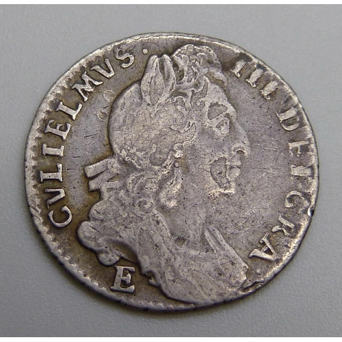 7244 - Coins; a William III 1697 silver sixpence 'E'