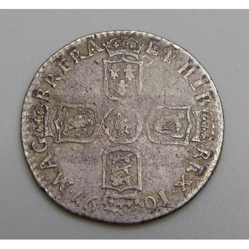 7244 - Coins; a William III 1697 silver sixpence 'E'