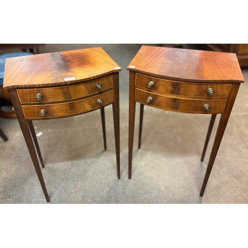 184 - A pair of Regency style mahogany two drawer bowfront lamp tables