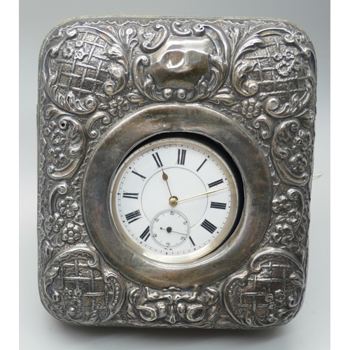 7265 - An embossed silver watch case, Birmingham 1908, and a silver pocket watch