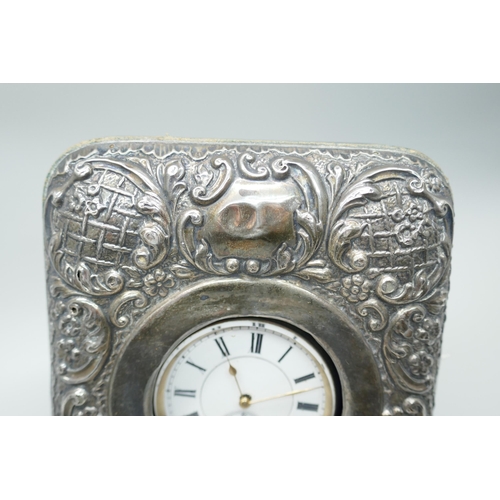 7265 - An embossed silver watch case, Birmingham 1908, and a silver pocket watch