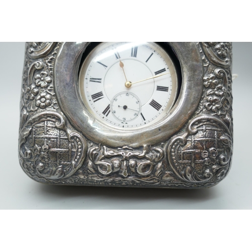 7265 - An embossed silver watch case, Birmingham 1908, and a silver pocket watch