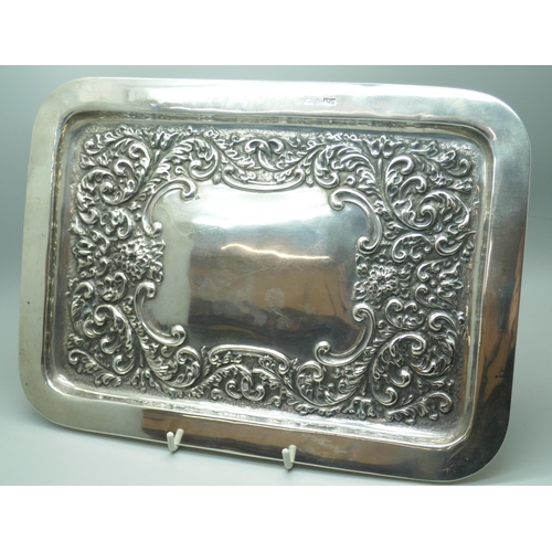 7268 - An embossed silver tray, hallmark worn, 268g, 20cm x 28.5cm