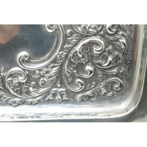 7268 - An embossed silver tray, hallmark worn, 268g, 20cm x 28.5cm