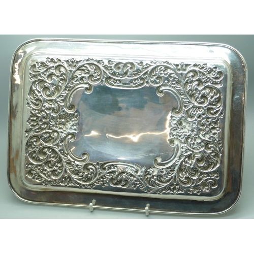 7268 - An embossed silver tray, hallmark worn, 268g, 20cm x 28.5cm