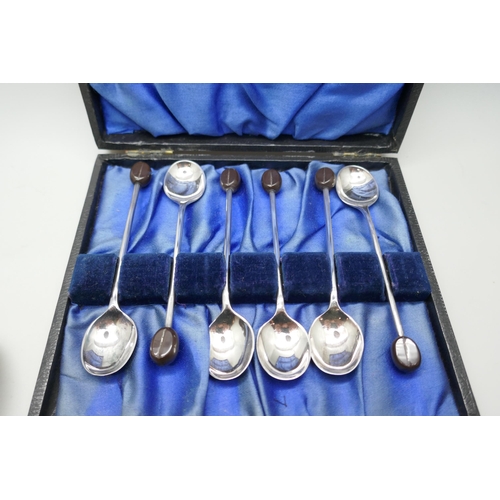 7274 - A cased set of six plated coffee bean spoons and four Georgian silver spoons, 76g