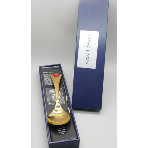 7291 - A Georg Jensen 2001 silver gilt spoon, strawberry,  Coloplast 10 Years, boxed