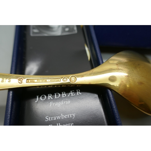 7291 - A Georg Jensen 2001 silver gilt spoon, strawberry,  Coloplast 10 Years, boxed