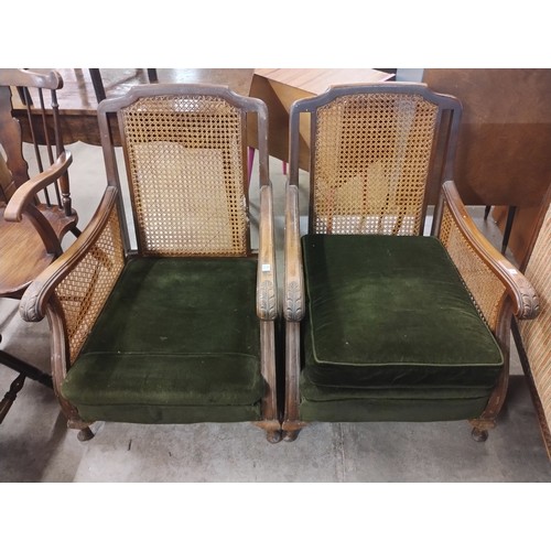 285 - A pair of early 20th Century beech bergere armchairs