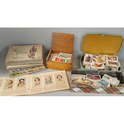2165 - A collection of cigarette cards, tea card albums including 1930s football