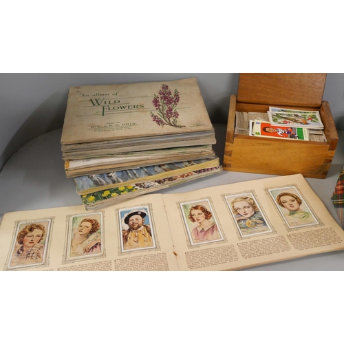 2165 - A collection of cigarette cards, tea card albums including 1930s football
