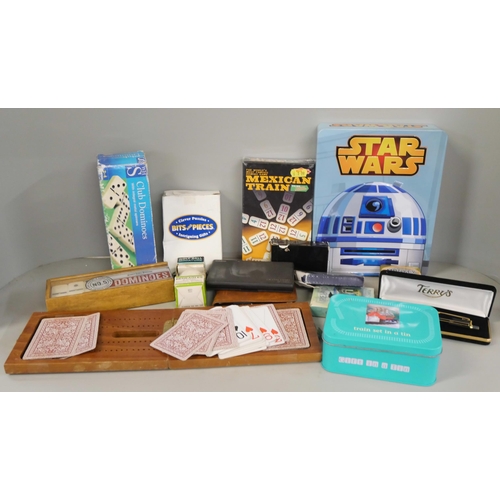 2337 - A collection of games including dominoes, playing cards and Star Wars lights in a tin **PLEASE NOTE ... 