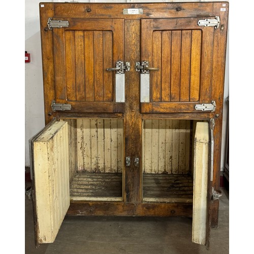 198 - An early 20th Century pitch pine four door larder cupboard