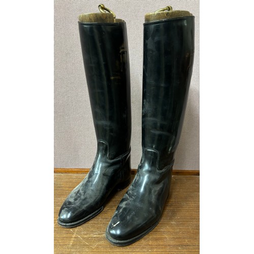 360 - A pair of vintage black leather riding boots, with treen trees