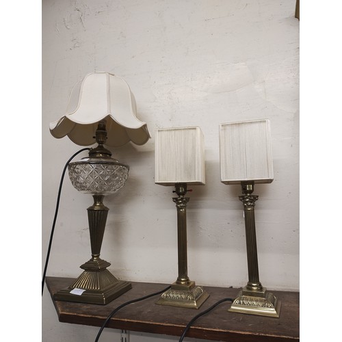 421 - A pair of brass Corinthian column table lamps and one other