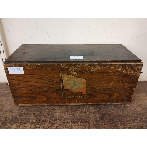 424 - A 1917 wooden first aid box, with paper instructions and contents