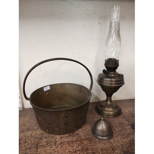 425 - A Victorian brass jam pan and a table lamp