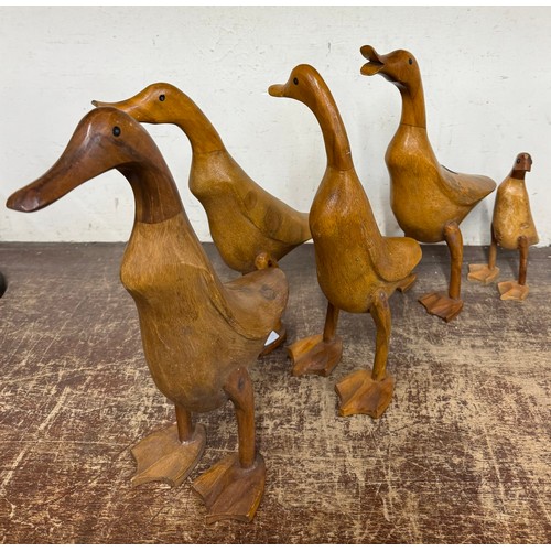 401 - Five carved teak figures of ducks