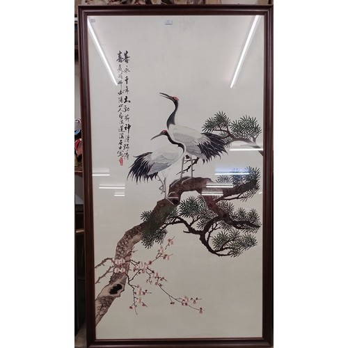 434 - A large Chinese embroidery depicting exotic birds, framed