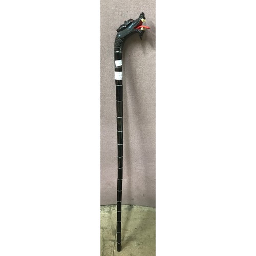 401A - An oriental carved dragons head walking cane